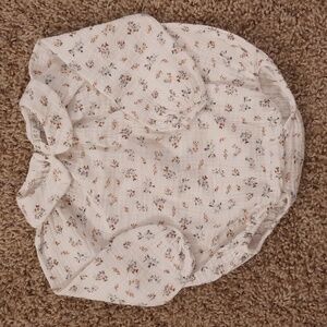 6 months Grace. bodysuit. White with tiny floral print in blue and salmon color